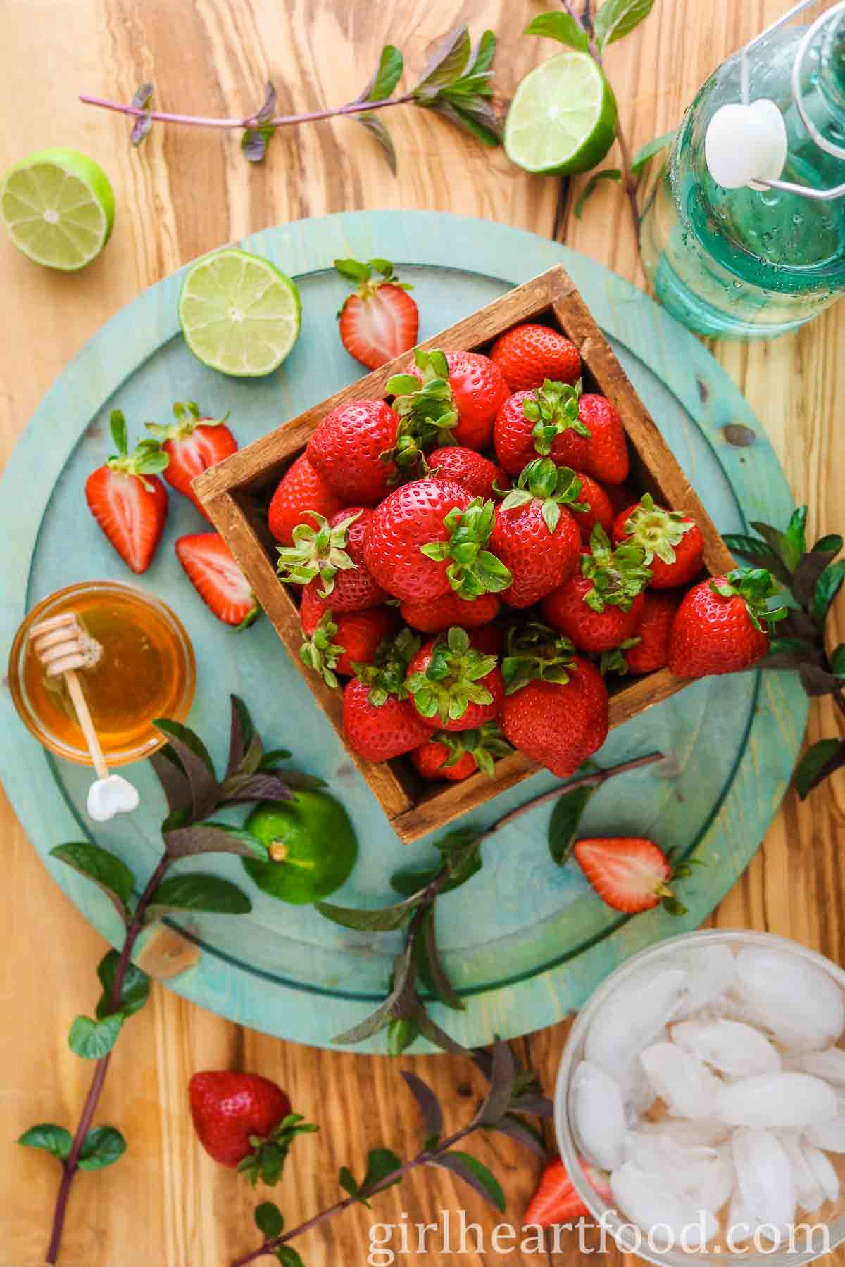 Ingredients for a non-alcoholic strawberry cocktail.