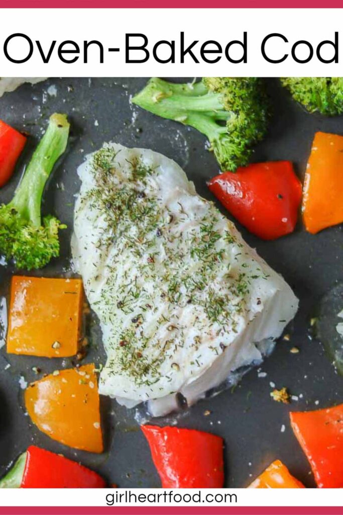 Portion of oven-baked cod with broccoli and bell pepper on a sheet pan.