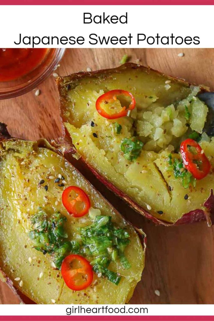 Two halves of a baked sweet potato with herb butter, sesame seeds & chili pepper.