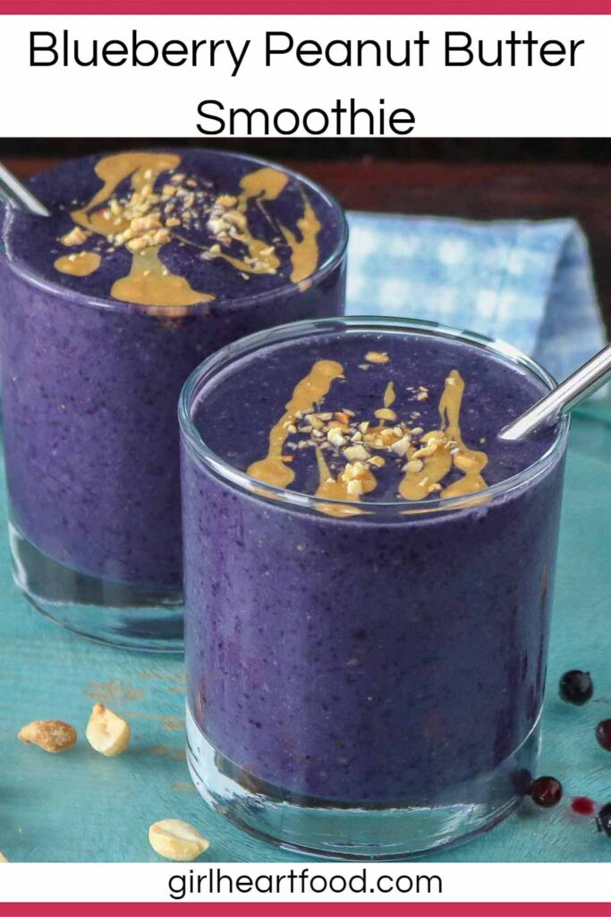Two glasses of blueberry peanut butter smoothie, one in front of the other.