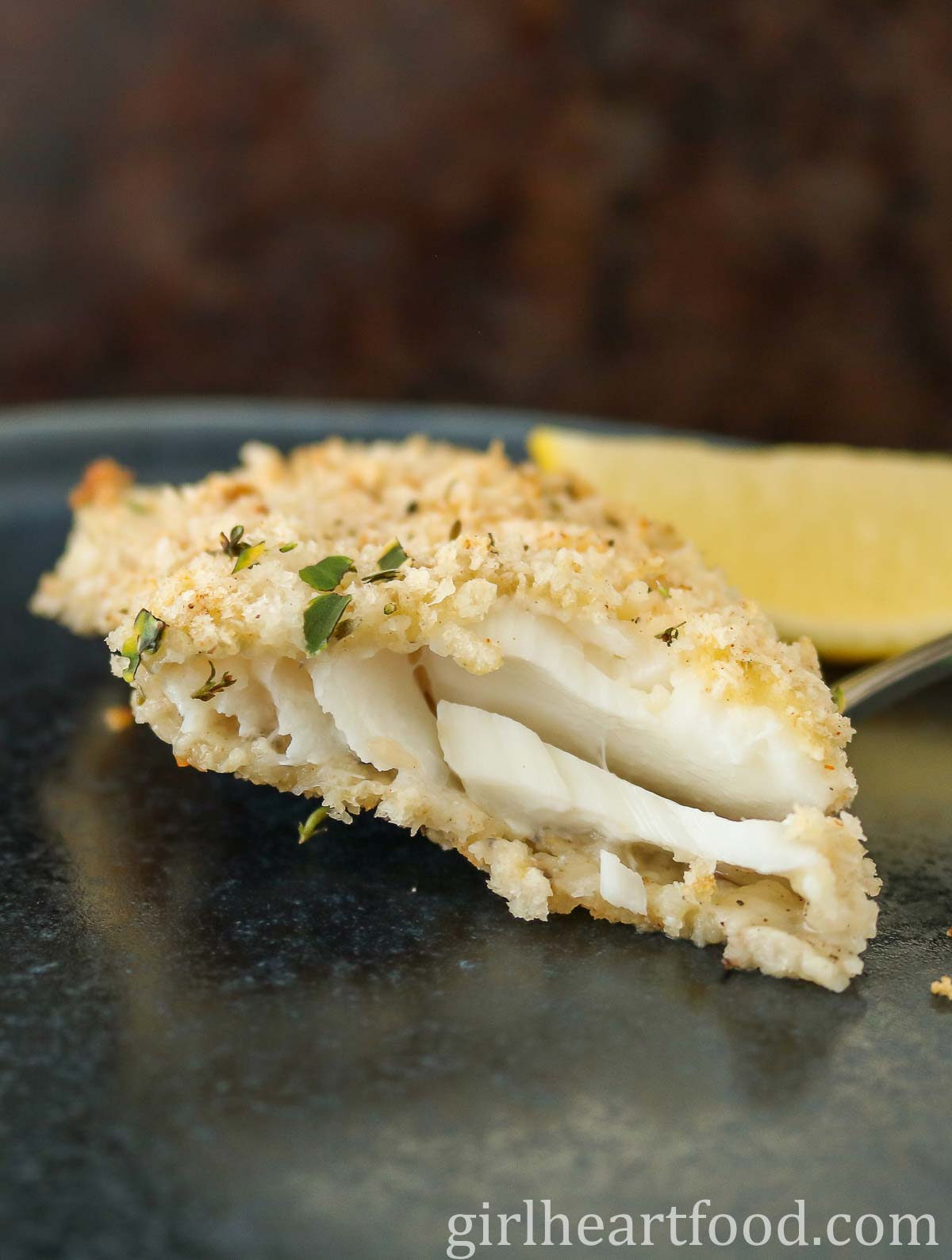 Close-up of a fillet of cooked cod, showing the interior texture.
