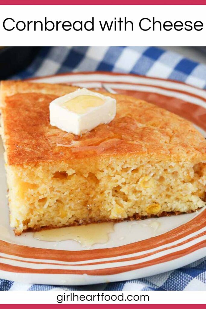 Slice of cornbread with a dab of butter and honey over top.