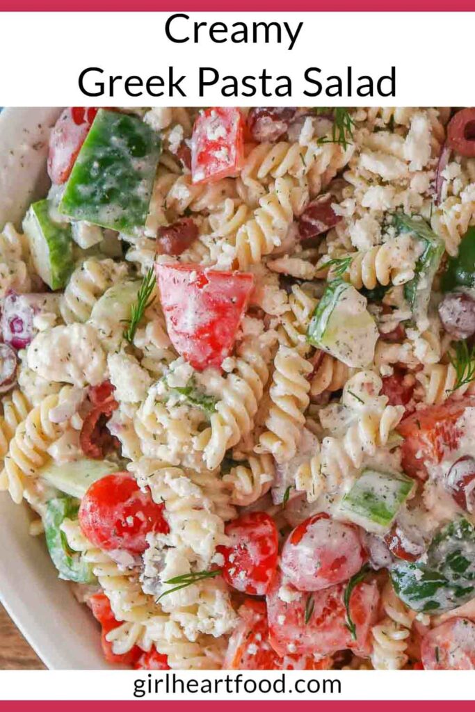 Close-up of creamy Greek pasta salad in a bowl.