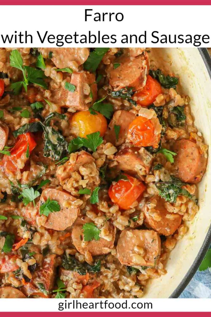 Close-up of sausage, farro and vegetables in a pan garnished with parsley.
