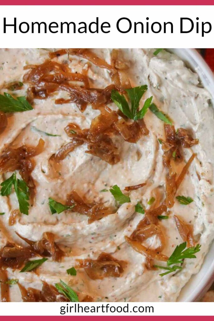 Close-up of a bowl of homemade onion dip garnished with caramelized onions and parsley.