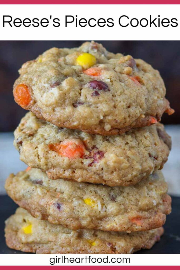 Stack of four Reese's cookies next to some candy.