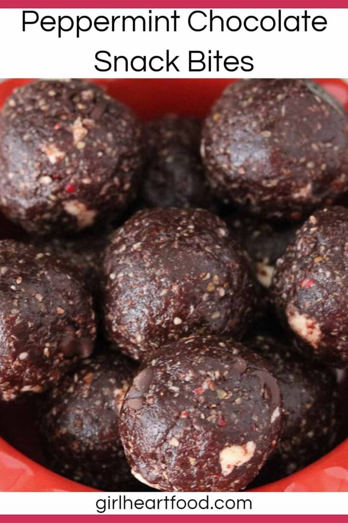Close-up of a red bowl of peppermint chocolate snack bites.