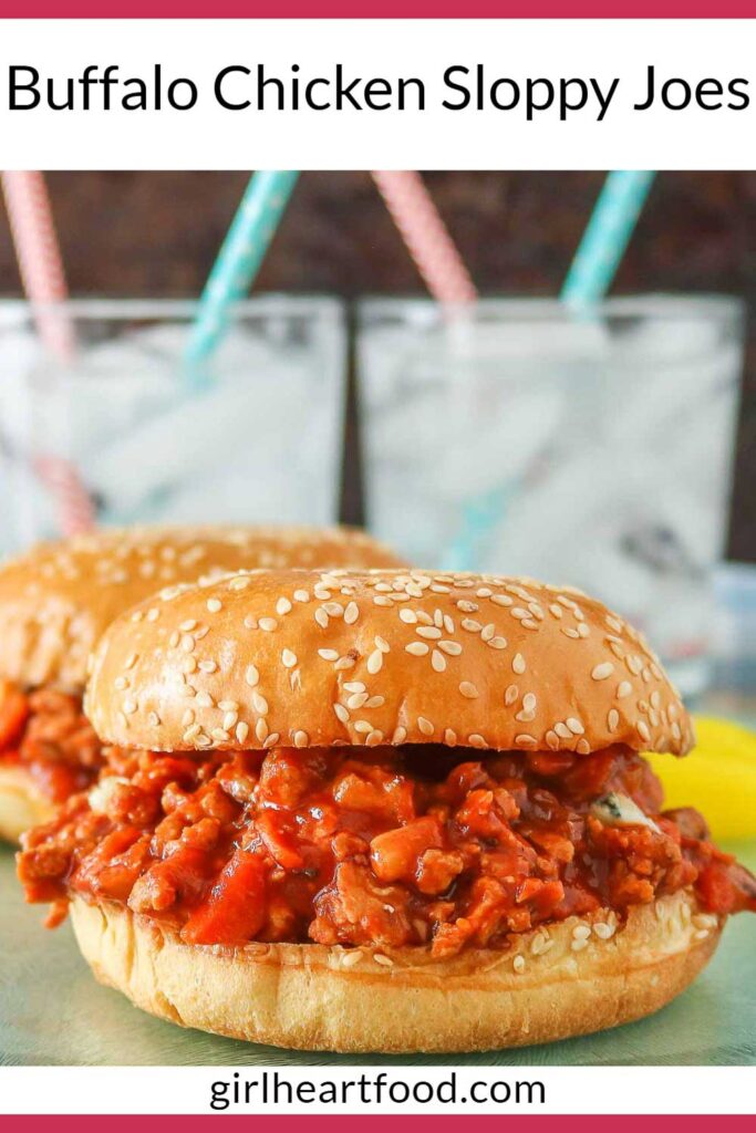Buffalo chicken sloppy joe, sitting in front of another sloppy joe and two glasses of water.