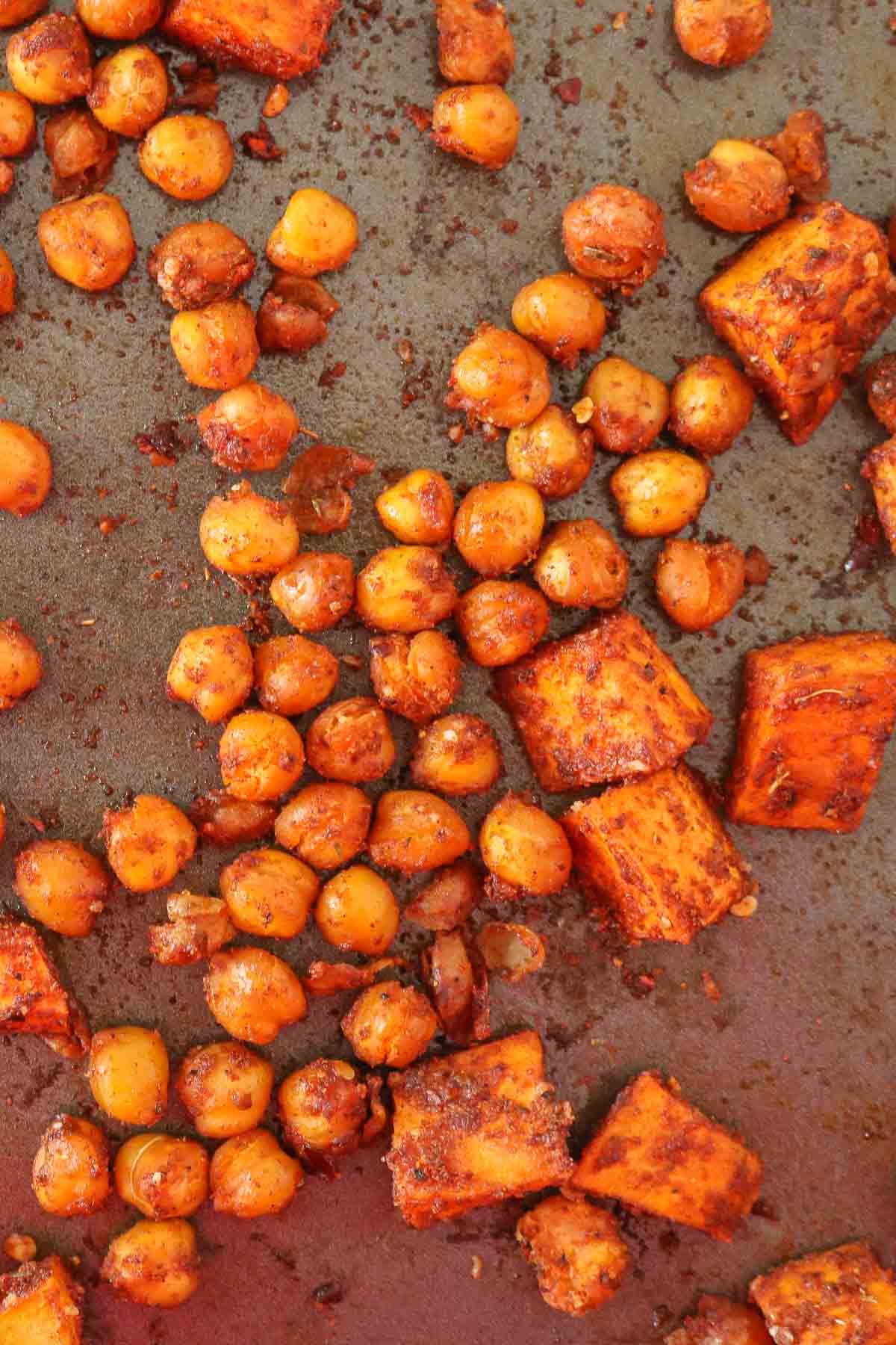 Roasted sweet potato and chickpeas on a sheet pan.