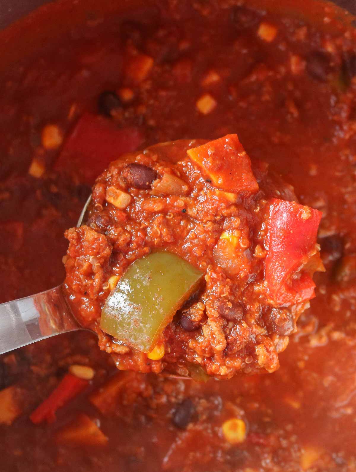 Close-up of a ladle of chili.