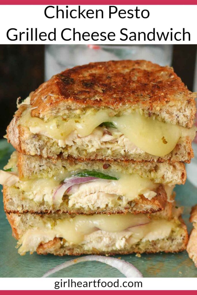 Stack of three halves of a chicken pesto grilled cheese sandwich.