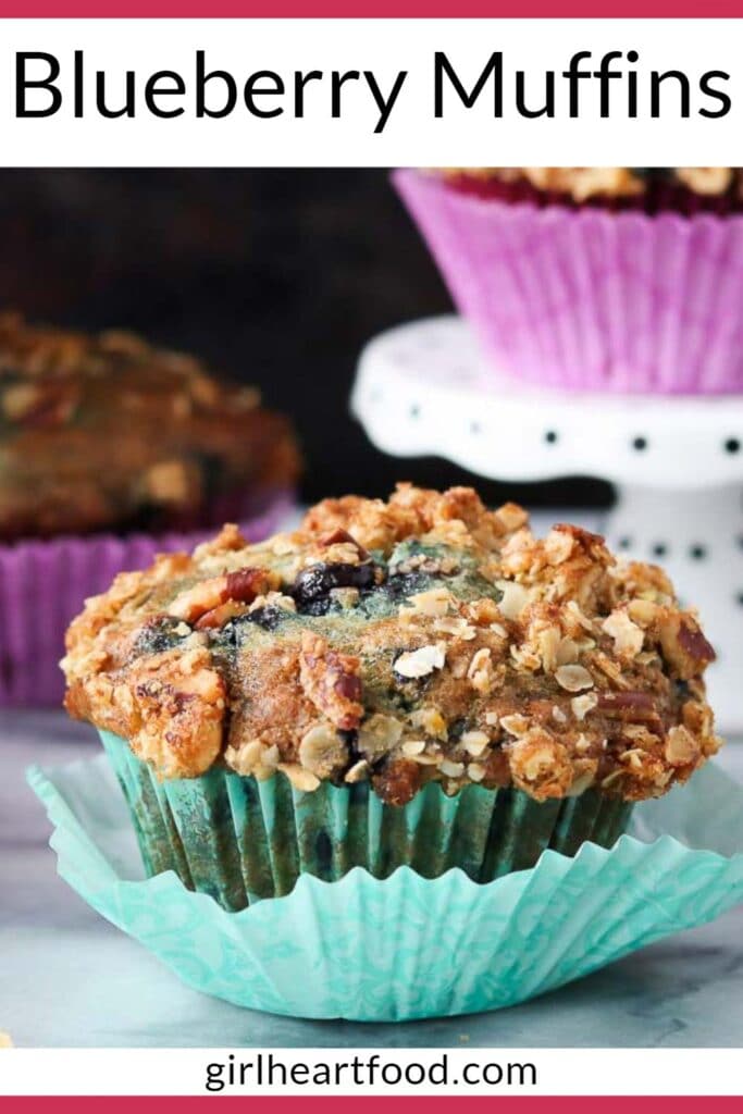 Blueberry muffin wrapped in a teal muffin liner.