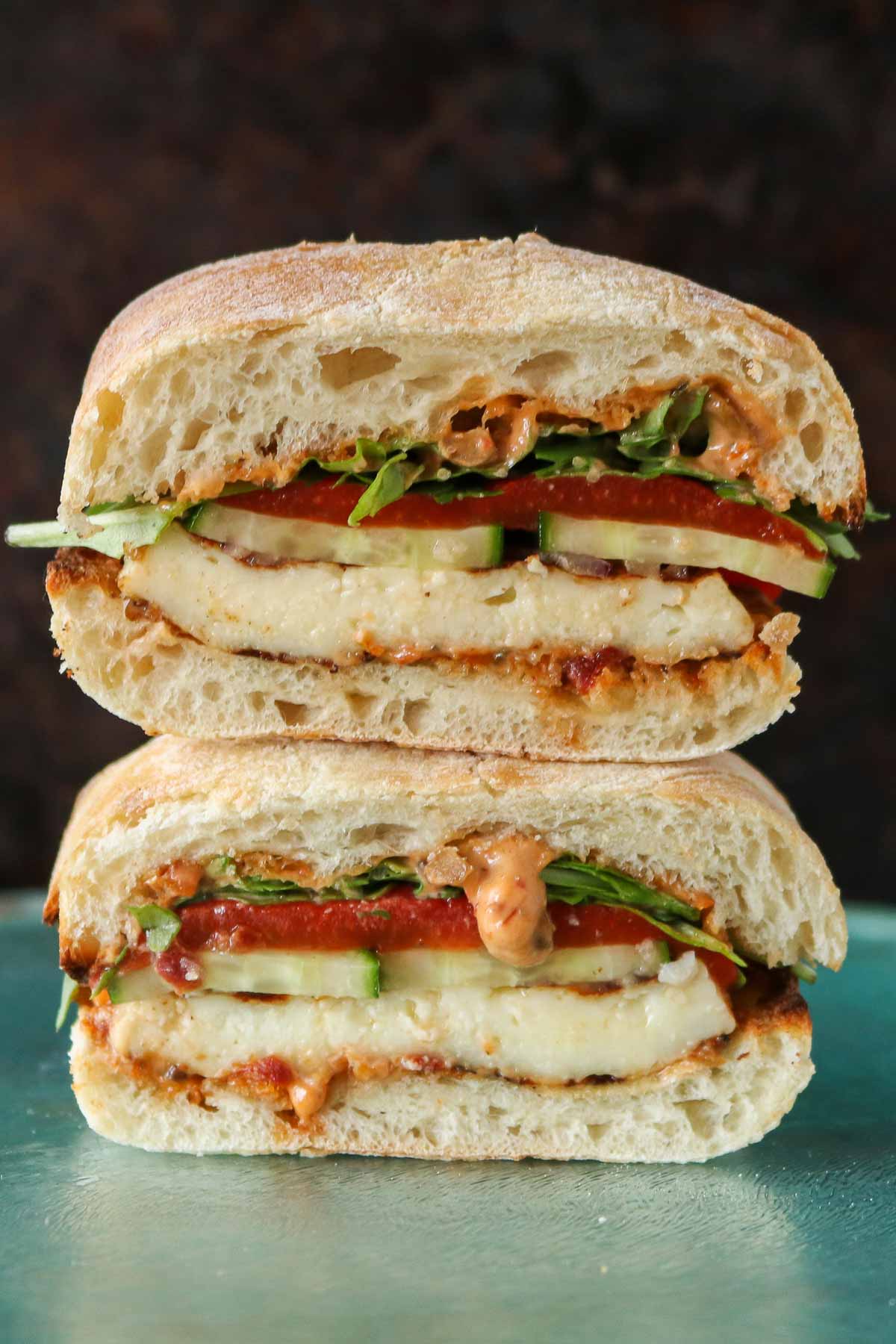 Stack of two halves of a halloumi sandwich.
