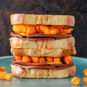 Stack of two fried bologna sandwiches.