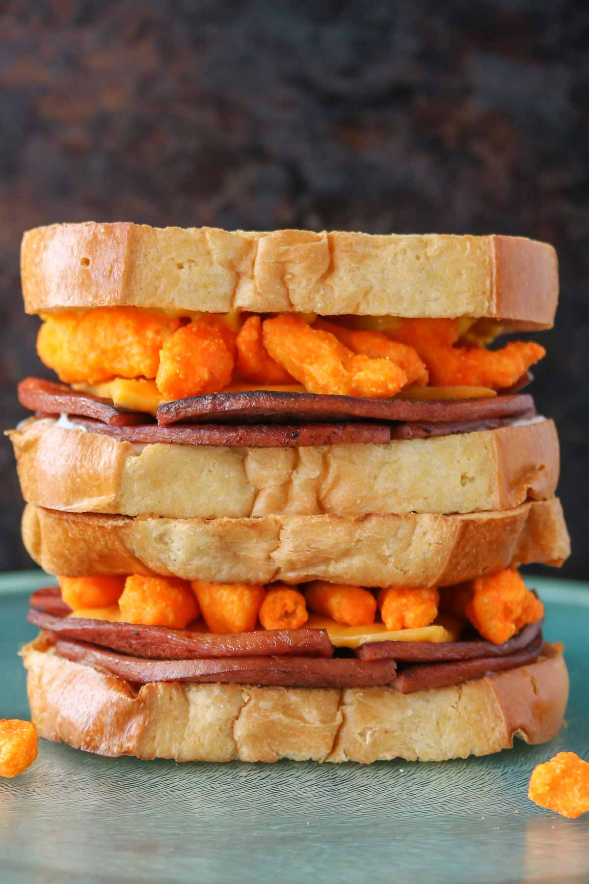 Stack of two fried bologna sandwiches.