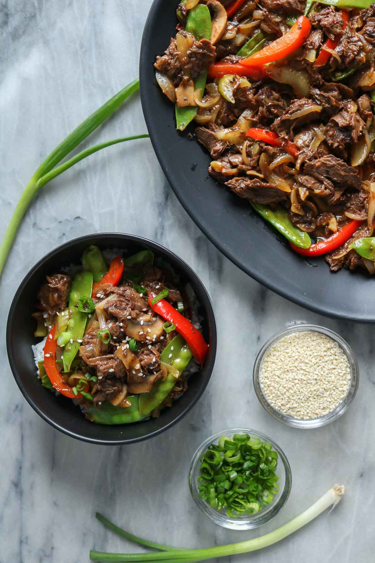Moose-stir-fry, some in a bowl over rice and more on a serving platter.