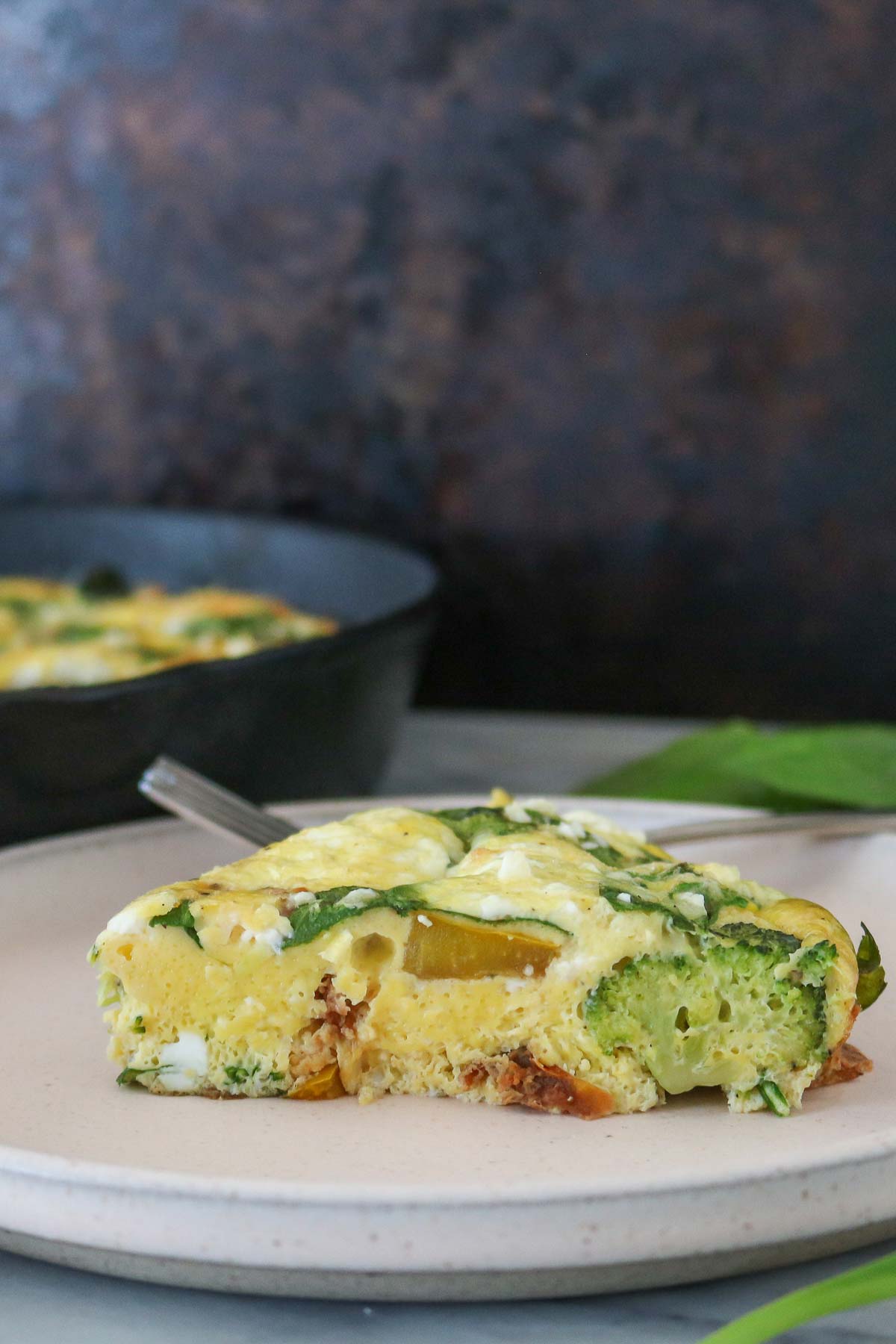 Slice of frittata on a plate.