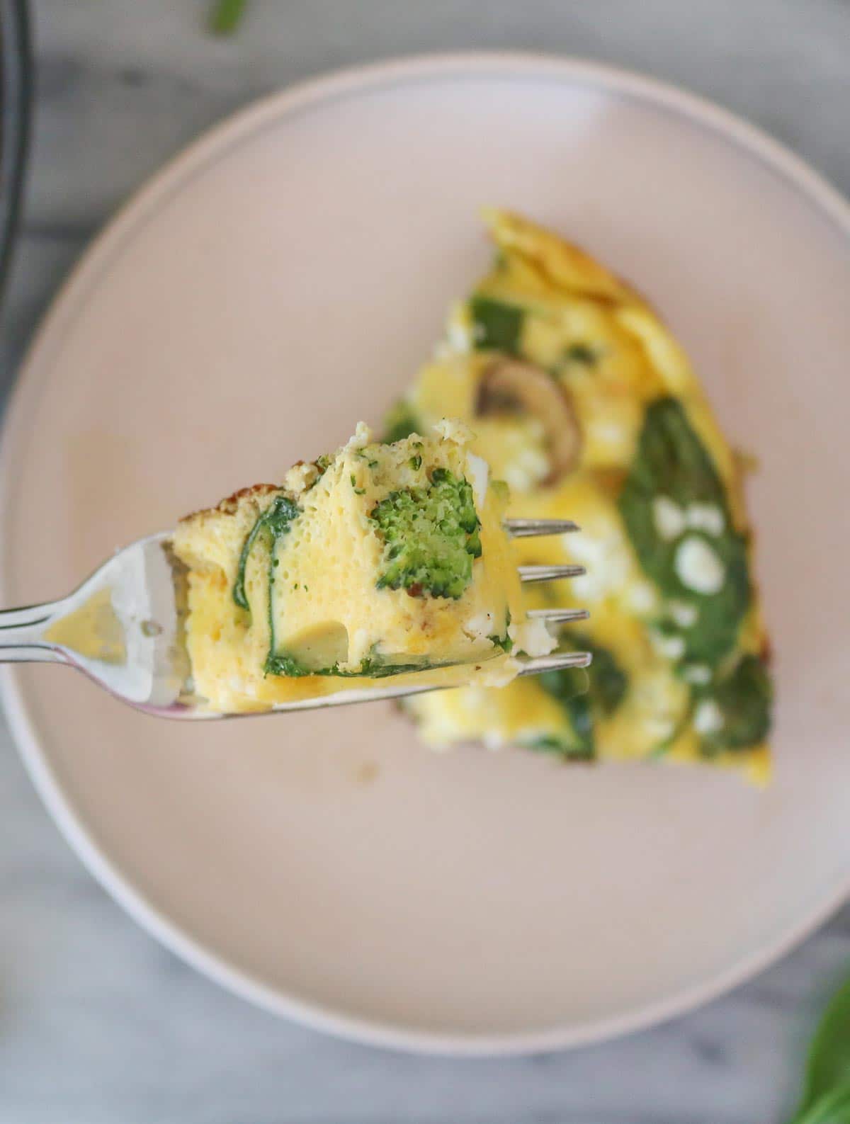 Forkful of frittata from a slice.