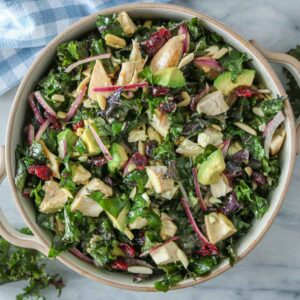 Chicken and kale salad in a serving bowl.