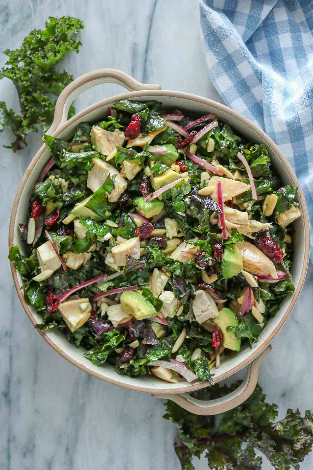 Chicken and kale salad in a serving bowl.