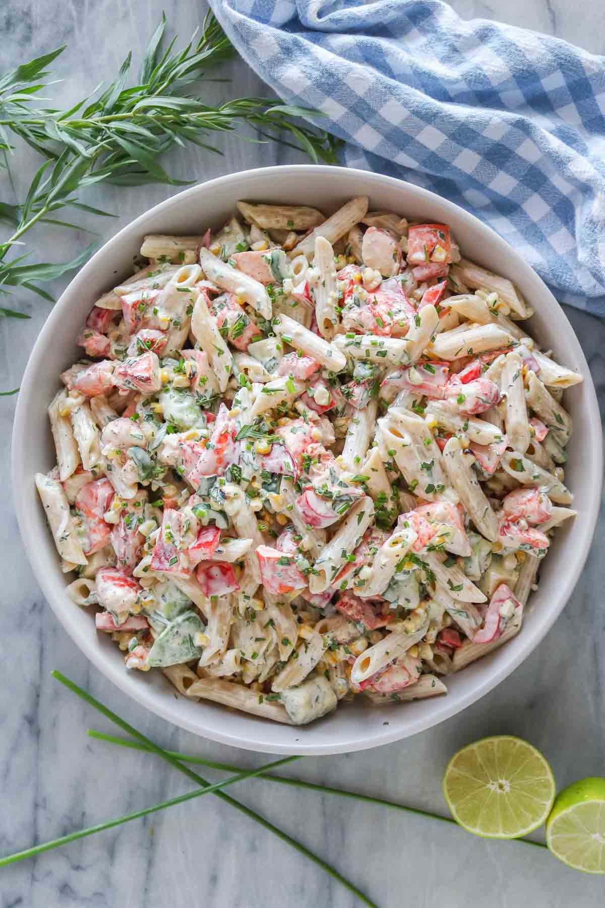 Lobster pasta salad in a serving bowl.
