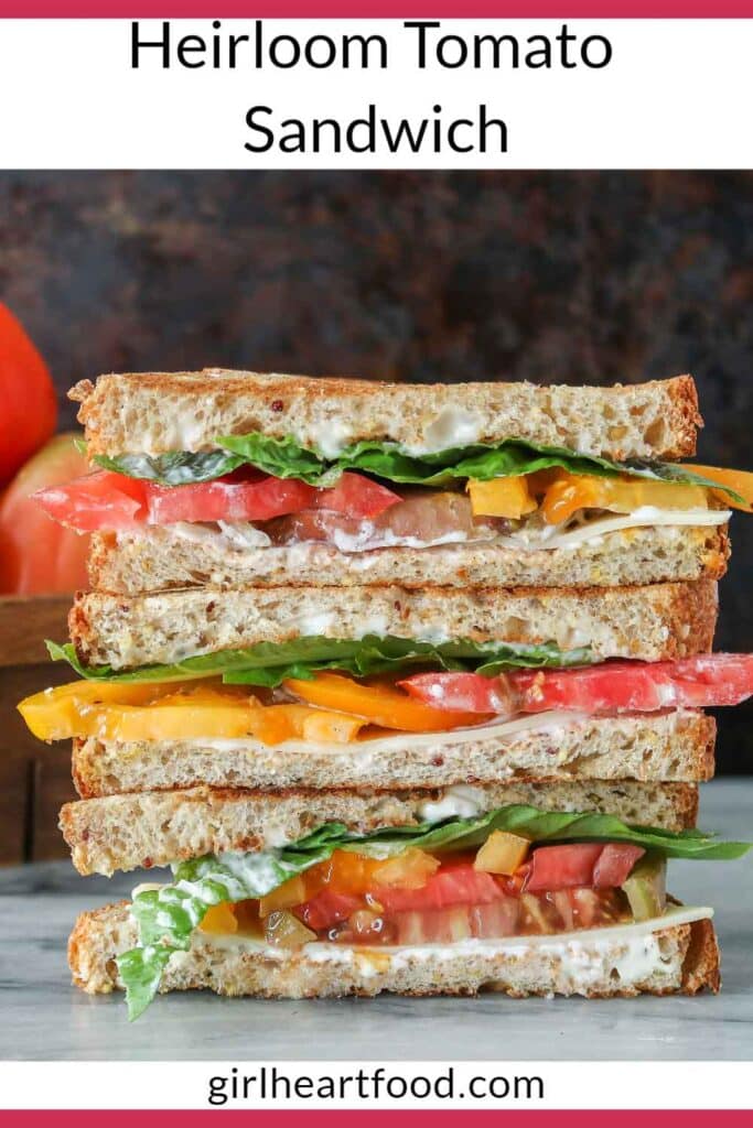 Stack of three heirloom tomato sandwich halves.