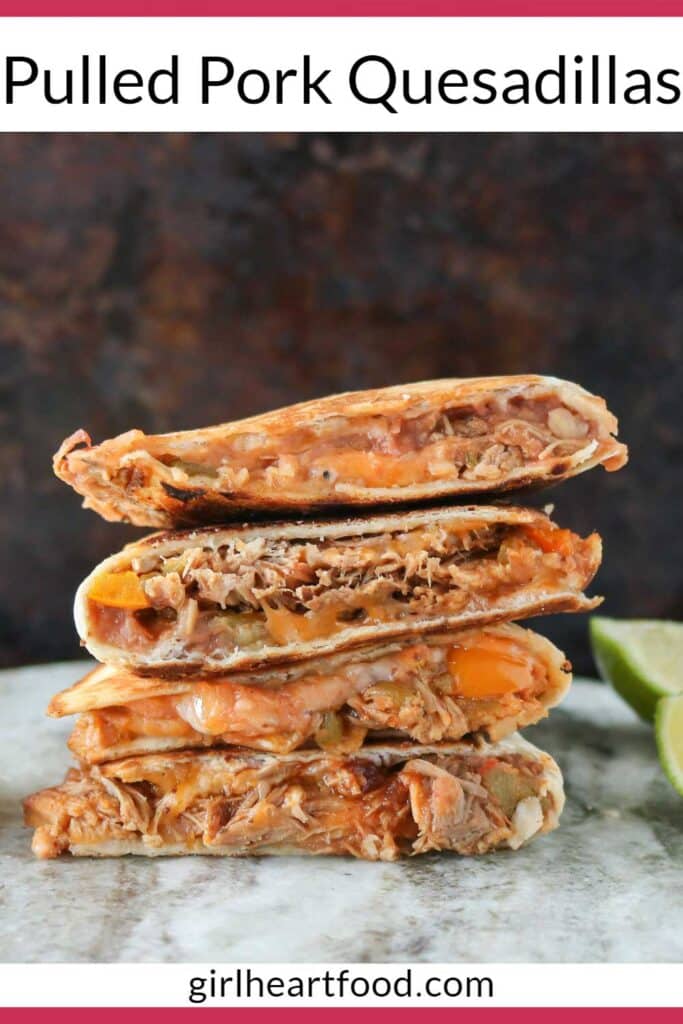 Stack of pulled pork quesadillas with lime wedges on either side.