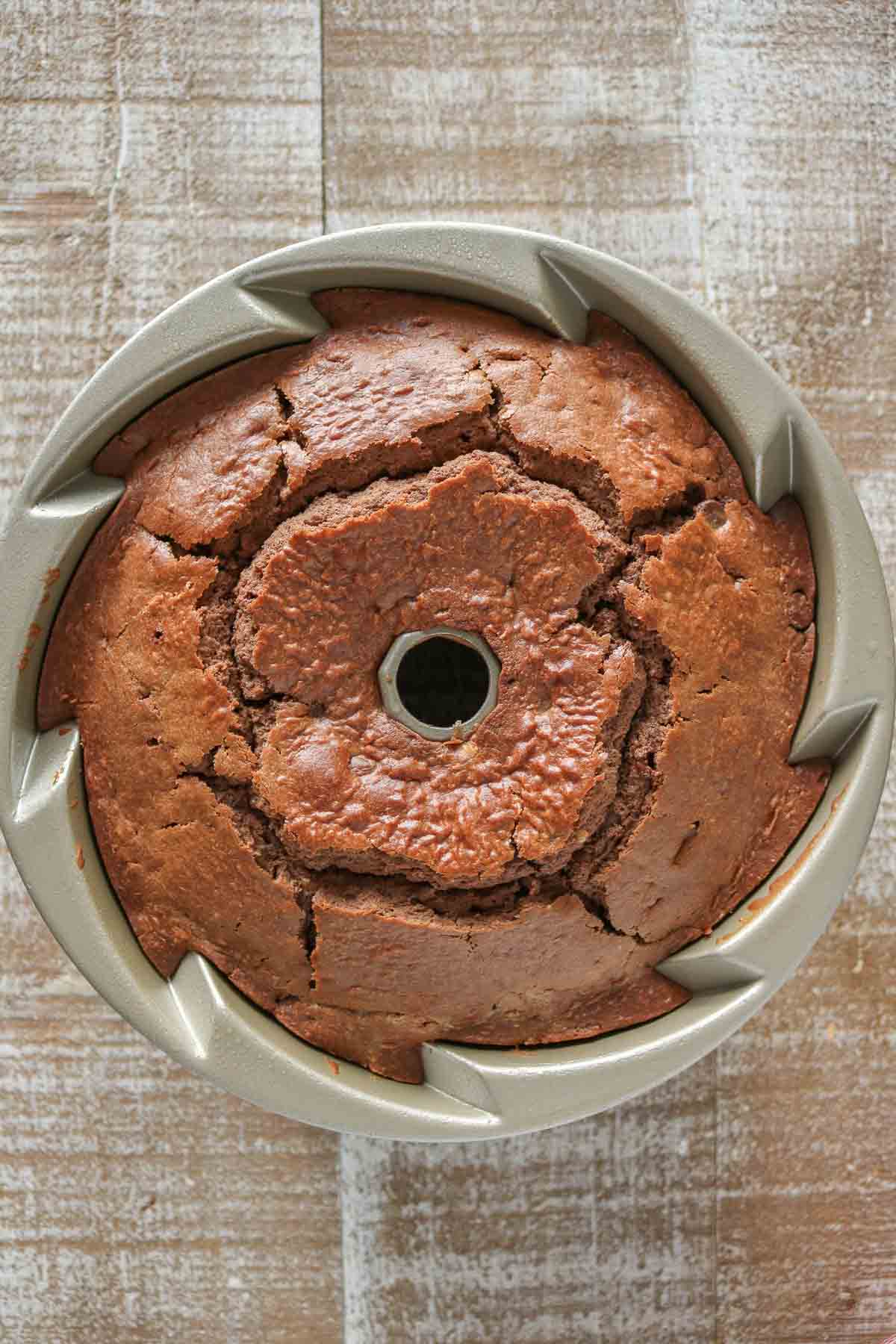 Baked cake in a fluted cake pan.