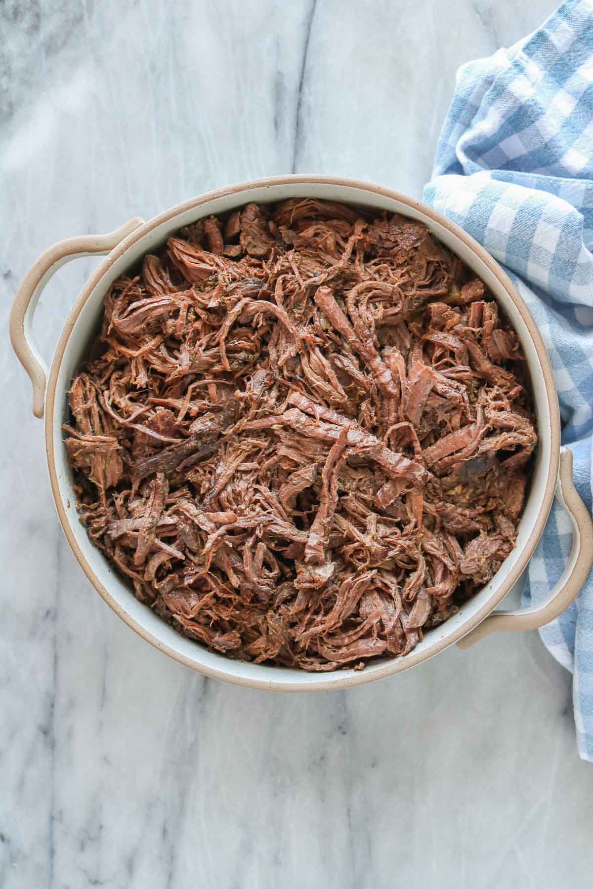 Shredded cooked moose meat in a serving dish.
