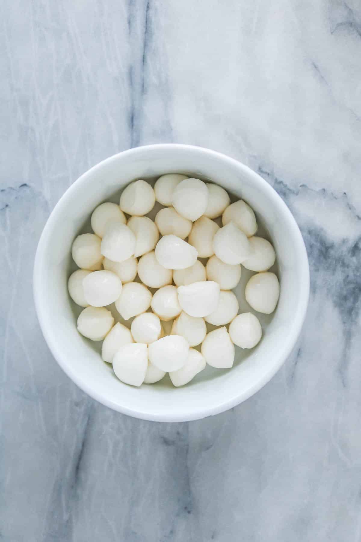 Bocconcini in a white bowl.