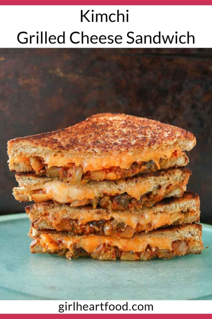 Stack of four kimchi grilled cheese sandwich halves.