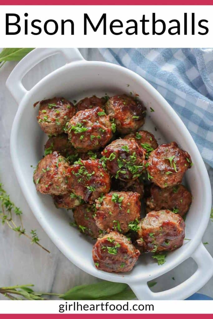 Bison meatballs in a serving dish garnished with parsley.