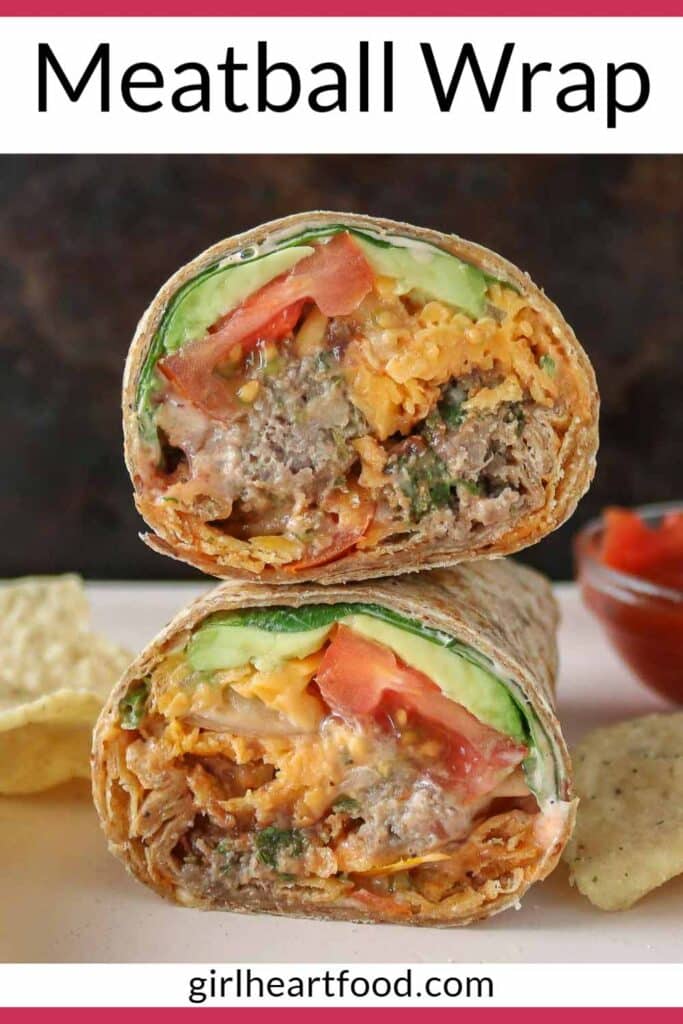 Two halves of a meatball wrap stacked on a plate with tortilla chips and dish of salsa.