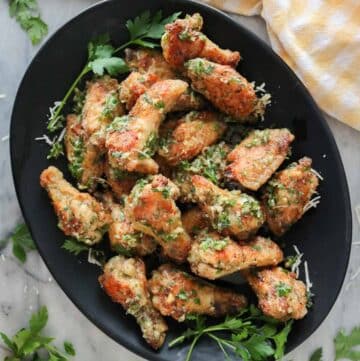 Garlic Parmesan chicken wings on a serving platter.