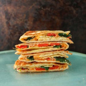 Stack of veggie and egg quesadillas.