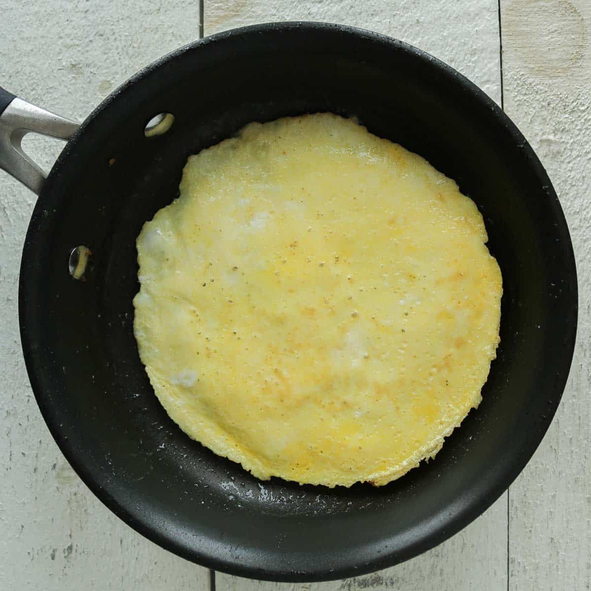 Cooked egg in a frying pan.
