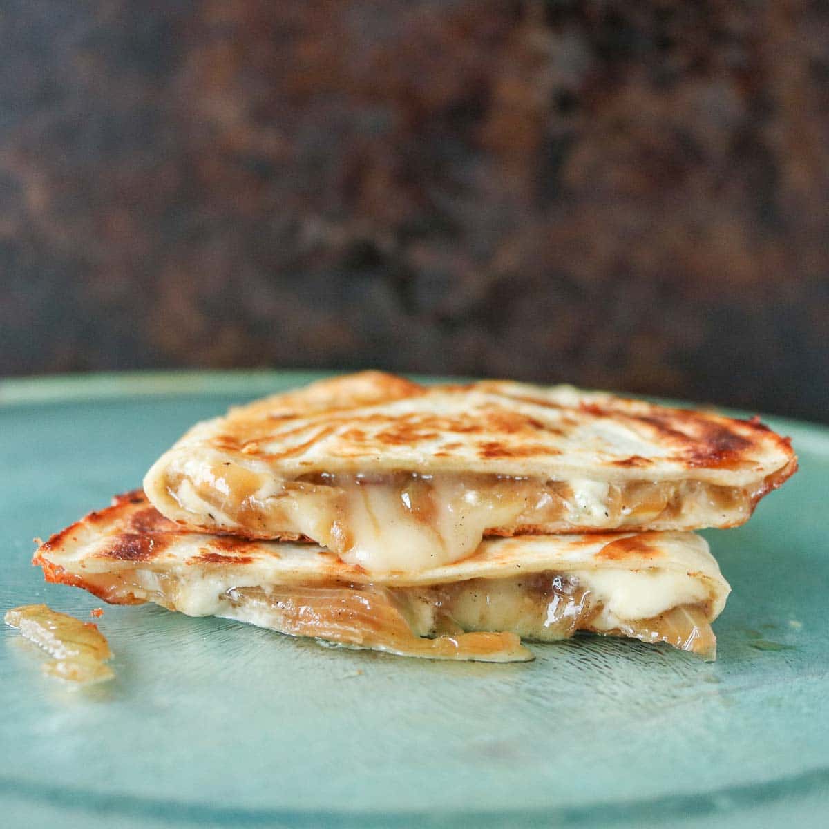 Stack of two caramelized onion quesadillas.