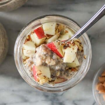 Jar of overnight oats with a spoon.