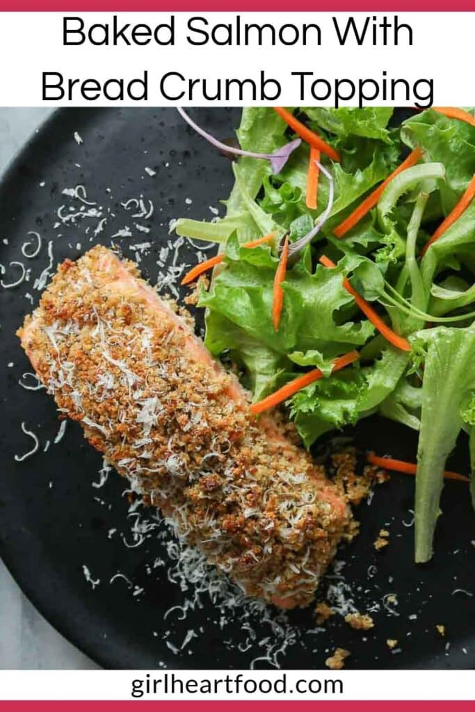 Portion of baked salmon and green salad on a plate.