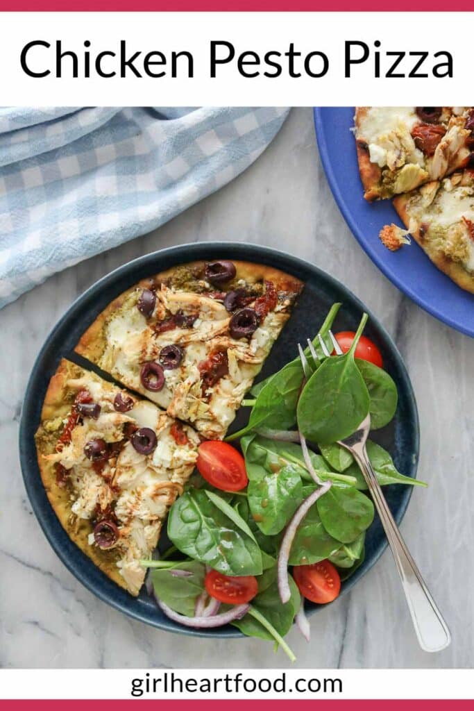 Two slices of pizza on a plate with spinach salad alongside a plate with more pizza slices.