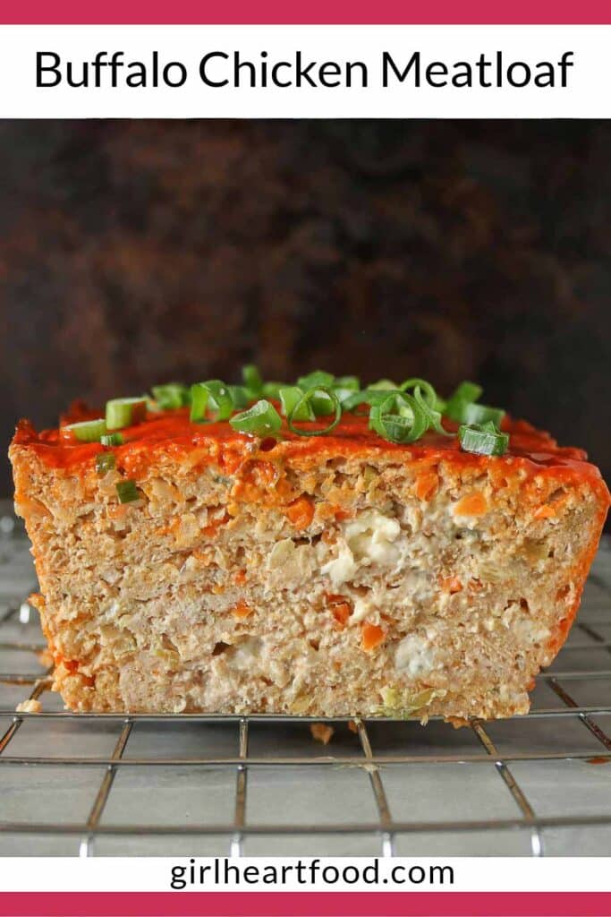 Meatloaf on a cooling rack showing the interior texture after a slice has been removed.