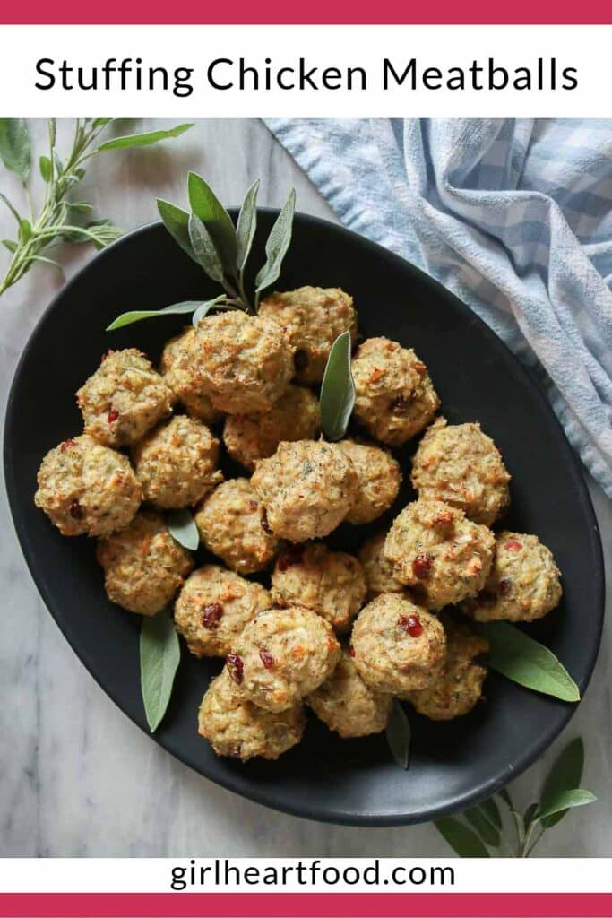 Stuffing chicken meatballs on a black platter.