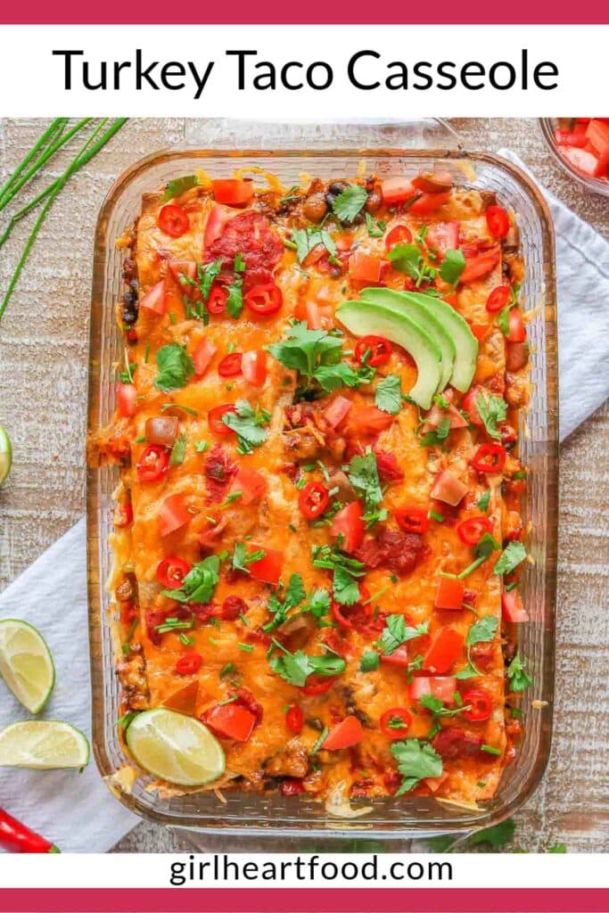 Turkey taco casserole garnished with toppings.